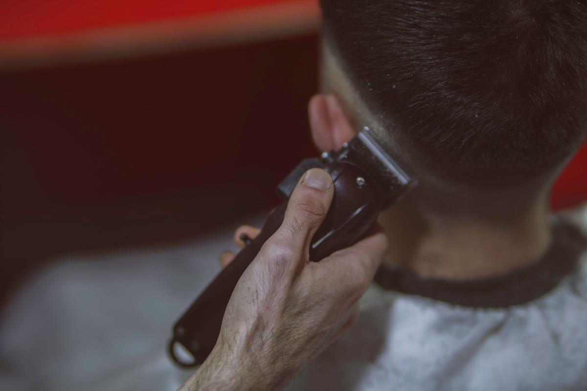 Close-up of a barber using clippers for a precise haircut
